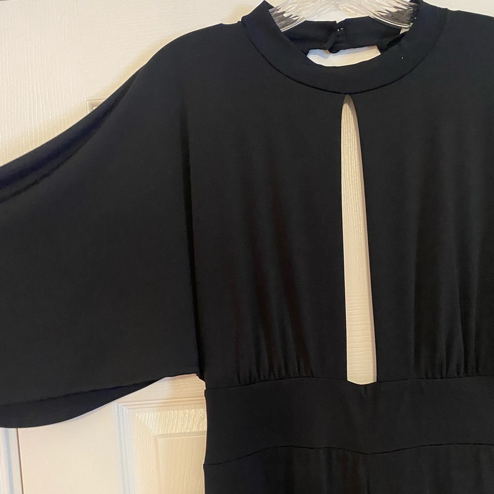 NEVER WORN Black Jumpsuit w low cut front and back